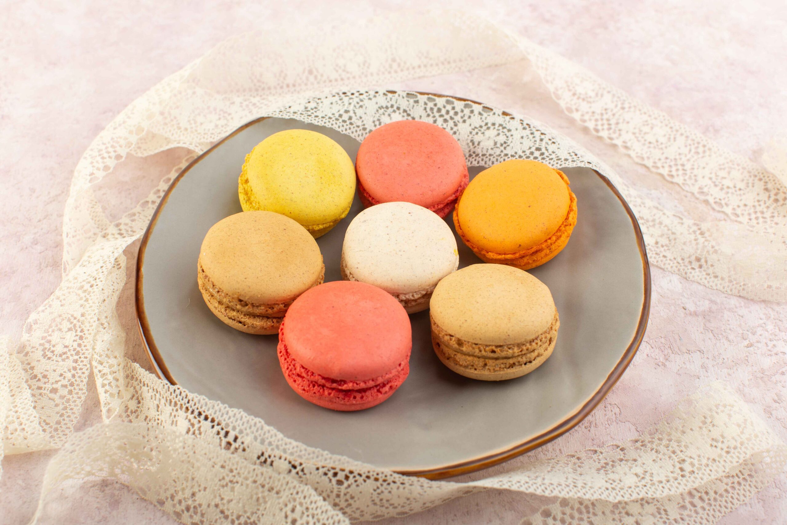 top-view-french-macarons-round-yummy-inside-plate-pink-table-cake-biscuit-sugar-sweet (1)